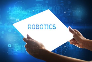 ROBOTICS yazıtlı el yapımı fütüristik tablet, yeni teknoloji kavramı