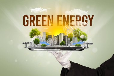 GREEN ENERGY yazıtları ve yenilenen enerji konseptiyle Eko Şehri 'ne hizmet eden garson