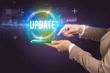 UPDATE yazıtı ve yeni teknoloji konseptiyle dokunmatik ekranın yakın plan görüntüsü