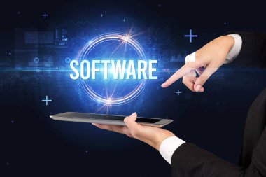 SOFTWARE yazıtlı bir dokunmatik ekran yakın plan, yeni teknoloji kavramı