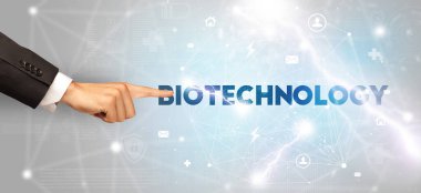 BIOTECHNOLOGY yazıtlarına el işareti, modern teknoloji kavramı