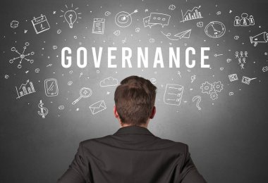 GOVERNANCE yazıtları, modern iş konsepti olan bir işadamının arka görüşü