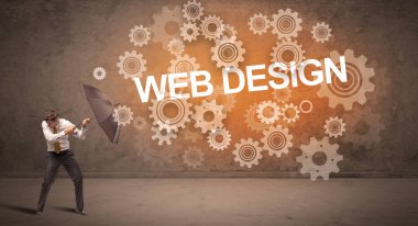 WeB DESIGN yazıtları ve teknoloji kavramından şemsiyeyle savunma yapan iş adamı