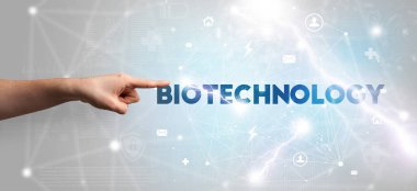 BIOTECHNOLOGY yazıtlarına el işareti, modern teknoloji kavramı