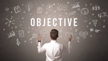 OBJECTIVE yazıtları olan bir iş adamının arka görüşü, modern iş kavramı