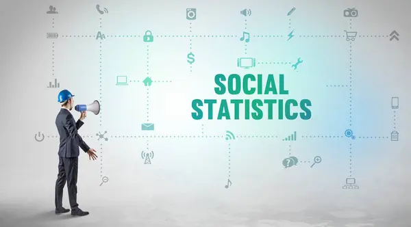 Engineer working on a new social media platform with SOCIAL STATISTICS inscription concept