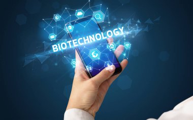 BIOTECHNOLOGY yazıtlı akıllı telefon, modern teknoloji konsepti