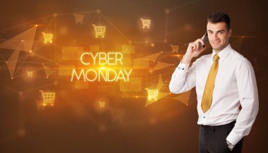 Alışveriş arabası ikonları ve CYBER Pazartesi yazıtları olan bir işadamı, online alışveriş konsepti kavramı kavramı