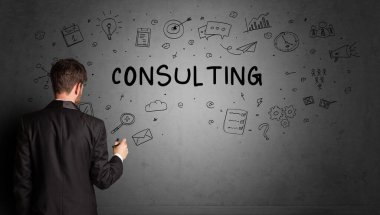 businessman drawing a creative idea sketch with CONSULTING inscription, business strategy concept