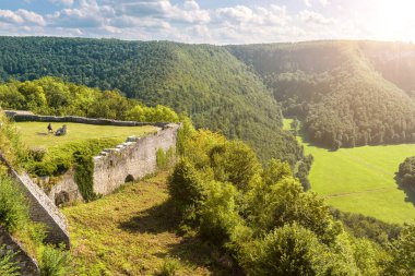 Mountain landscape with Hohenurach Castle, Bad Urach, Germany. Scenic view of Swabian Alps from old German castle in summer. Theme of tourism, nature, travel and sightseeing in Baden-Wurttemberg.