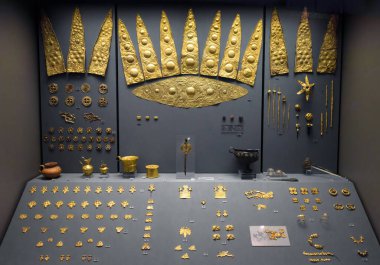 Athens - May 7, 2018: Gold artifacts, jewelry from Ancient Greek Mycenae in National Archaeological Museum of Athens, Greece. Theme of treasure, history, culture, archeology and past civilization. 