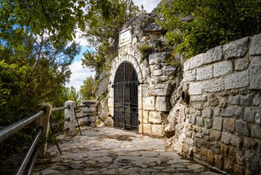 Grotto of Lermontov in Pyatigorsk, Stavropol Krai, Russia. Scenery of old landmark of Pyatigorsk installed in 1831, historical place in summer. Theme of sightseeing, tourism and travel in Pyatigorsk.