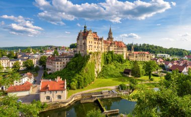 Sigmaringen city in Baden-Wurttemberg, Germany. Scenic view of old German castle on rock top, landmark of Schwarzwald. Panorama of Swabian town at Danube River in summer. Travel and tourism theme.