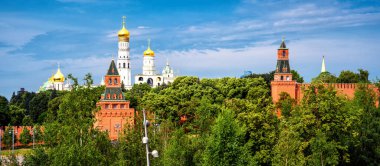 Moscow Kremlin in summer, Russia. Panoramic view of its towers, wall and cathedrals from Zaryadye park. Panorama of top Moscow landmark. Concept of travel, nature, landscape and tourism in Moscow.