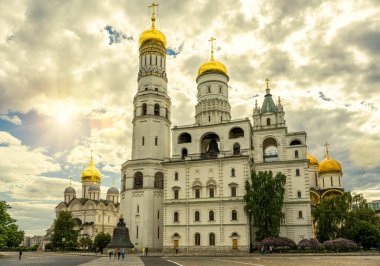 Cathedrals of Moscow Kremlin, Russia. Scenery of old Russian Orthodox churches in Moscow city center. This place is famous tourist attraction of Moscow. Sunny view of Moscow temples in summer.