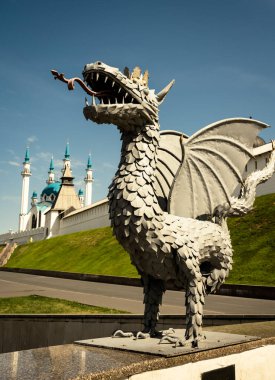 Kazan - June 16, 2021: Kazan Kremlin in summer, Tatarstan, Russia. It is top tourist attraction of Kazan and UNESCO World Heritage Site. White fortress and statue of dragon, symbol of city. 