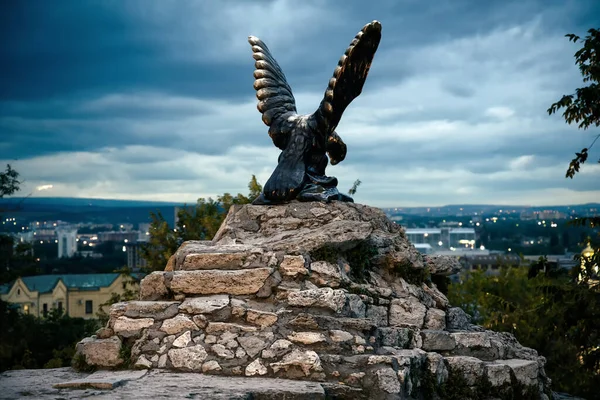 Eagle statue at night, Pyatigorsk, Stavropol Krai, Russia. Scenery of old symbol of Pyatigorsk installed in 1901, monument on mountain top. Theme of skyline, Caucasus, tourism and travel in Pyatigorsk
