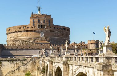 Castel Sant`Angelo or Castle of Holy Angel, Rome, Italy. It is famous landmark of Roma. View of old Castel Sant`Angelo, sky and medieval bridge with Renaissance statues. Theme of tourism, travel.