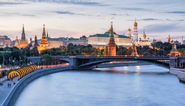 Moscow Kremlin at Moskva River, Russia. Scenery of Moscow city center at sunset. Beautiful Moscow cityscape at blue dusk, nice landscape of Russian capital. Travel and tourism in Russia theme.