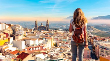 Woman tourist at Jaen, looking at panoramic view of the cathedral- Spain