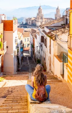 Woman tourist looking at cathedral of Jaen in Spain
