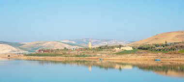 Panorama landscape with lake,  mosque and mountain- Morocco