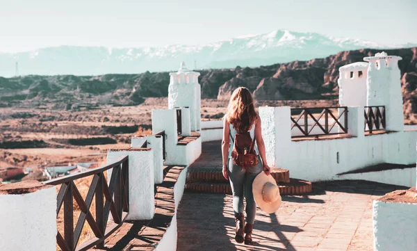 stock image Traveling in Andalusia- Woman walking in Jaen countryside and Sierra nevada in the background