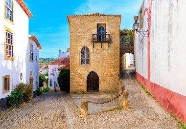 Obidos street city , near Lisbon in Portugal- Family vacation, travel, tourism clipart