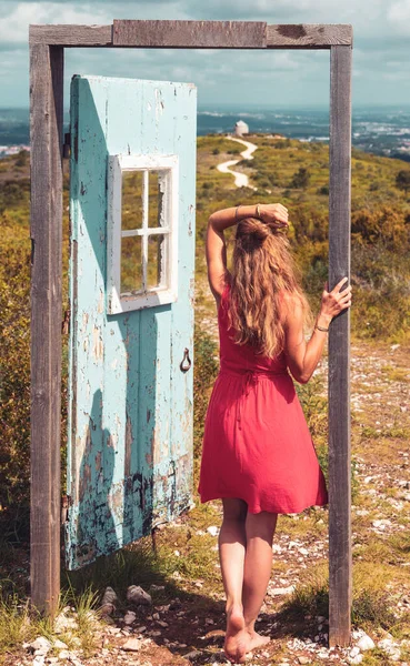 Woman and door in the nature- freedom,  lifestyle,  travel concept