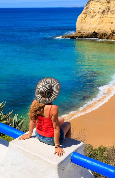 stock image Woman sitting and looking at atlantic ocean- Algarve beach in Portugal