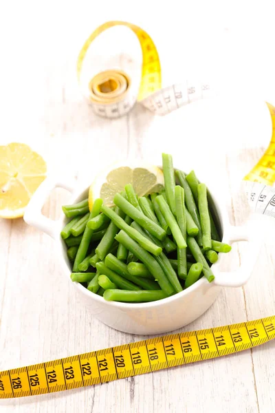 green bean and meter tape- diet food concept