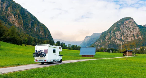 Camper on the road, mountain in the background- Travel, tour tourism,vacation in Slovenia-Europa