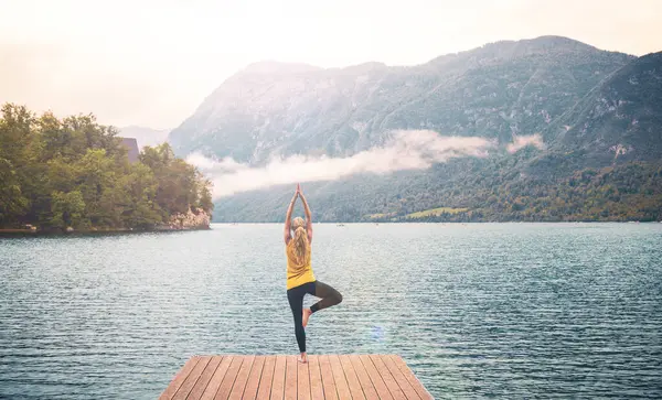 Woman Doing Yoga Exercise Pier Lake Mountain Morning Sport Relaxation — Stock Photo, Image