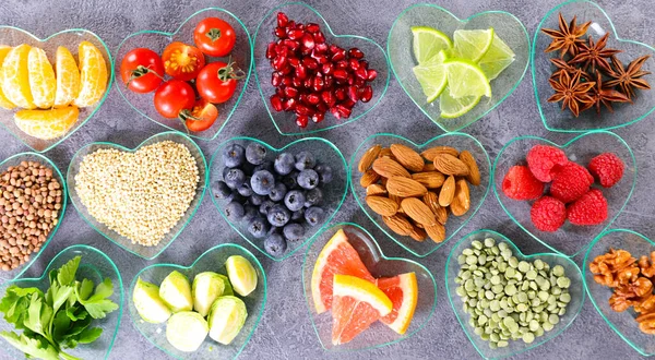 selection of healthy food- Super food, various fruits with berries, nuts and seeds