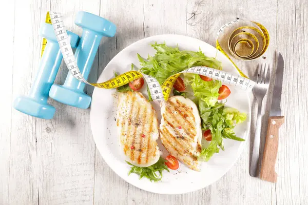 Grilled Chicken Breast Lettuce Dumbbell Measuring Tape Stock Picture