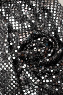 Pullu parlak kumaş dokusu..