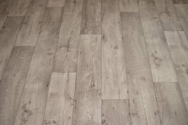 White linoleum with a wood texture.