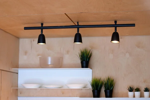 Track metal lamps in the loft interior.