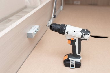 Assembling a new bed using a screwdriver