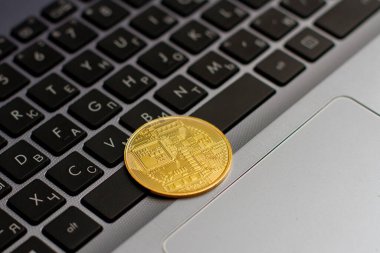 Bitcoin in keyboard of a laptop