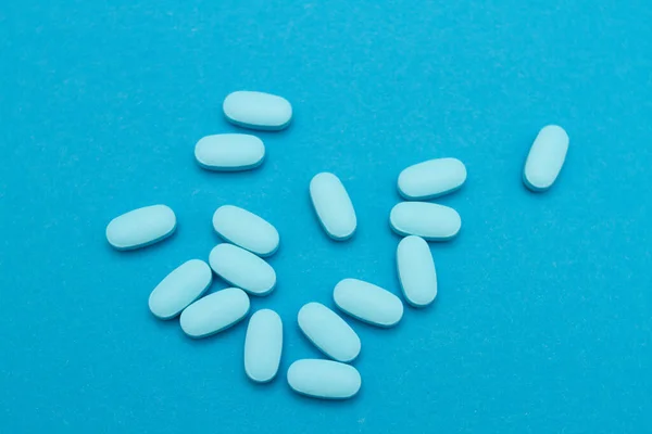 Blue pills for potency on blue background