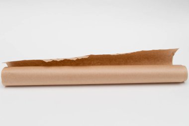 Roll of baking parchment paper on white background