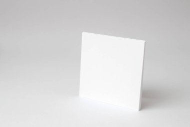 A blank square white empty paper on white background