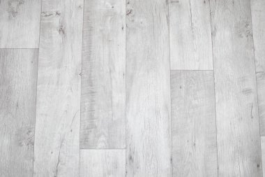 White linoleum with a wood texture. Types of floor coverings.