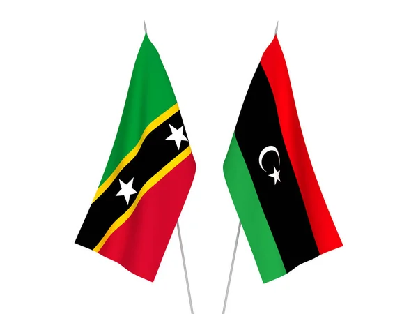 Stock image National fabric flags of Libya and Federation of Saint Christopher and Nevis isolated on white background. 3d rendering illustration.