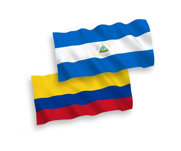 尼加拉瓜和哥伦比亚的国家病媒织物波条旗在白色背景下隔离 1比2的比例 — 图库矢量图片
