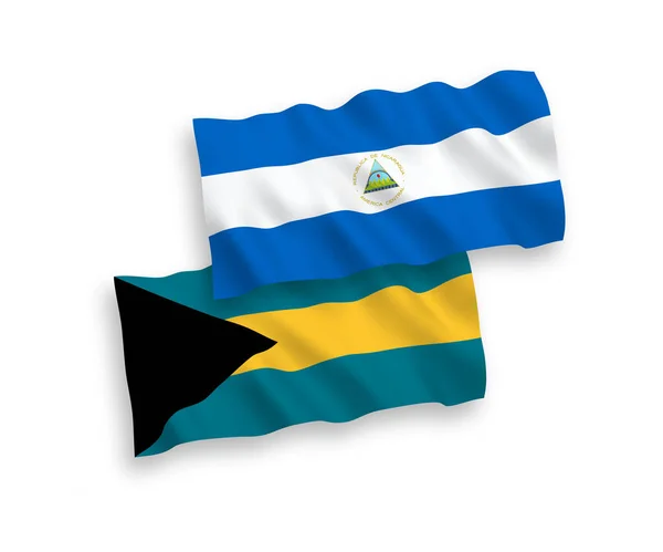 尼加拉瓜和巴哈马联邦的国家病媒织物波条旗在白色背景下隔离 1比2的比例 — 图库矢量图片