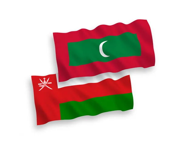 Nationell Vektor Tyg Våg Flaggor Sultanatet Oman Och Maldiverna Isolerad — Stock vektor