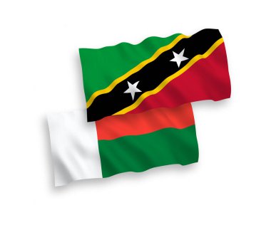 National vector fabric wave flags of Federation of Saint Christopher and Nevis and Madagascar isolated on white background. 1 to 2 proportion.