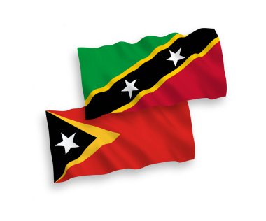 National vector fabric wave flags of Federation of Saint Christopher and Nevis and East Timor isolated on white background. 1 to 2 proportion.